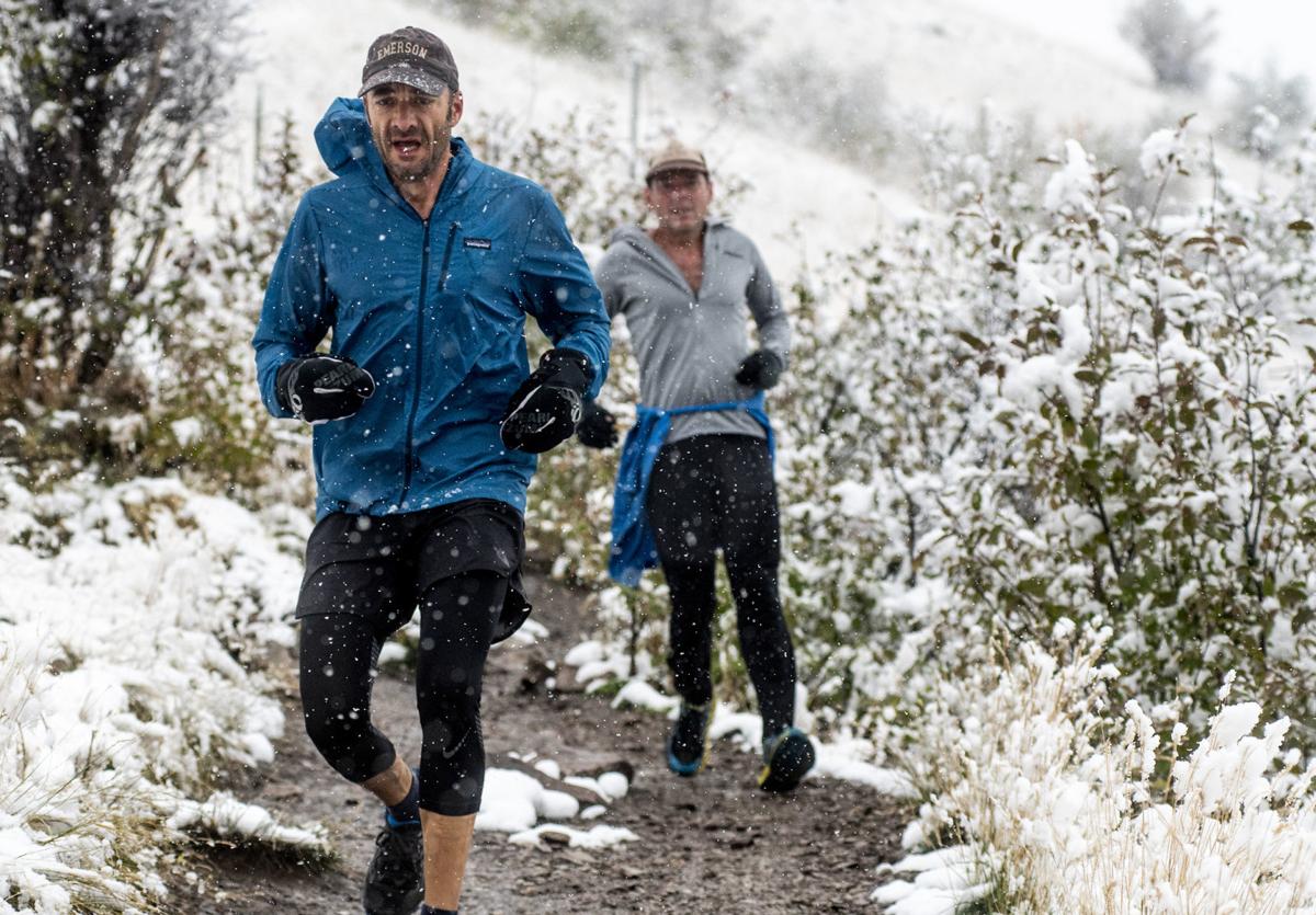 Mount Sentinel runners under snowfall