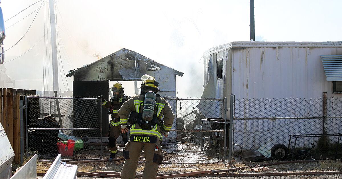 Two people injured, two families displaced in Monday multi-structure fire on Riverwood Lane.