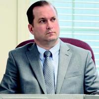 Board names Auman