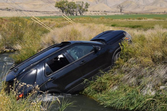 Youth saved after crashing into canal