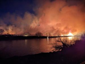 Rattlesnake Gulch fire burns historic waterwheel, power poles and trees