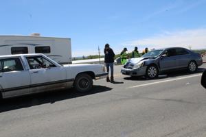 Two vehicles collide on N. Townsend Ave. after driver turns across all lanes of traffic