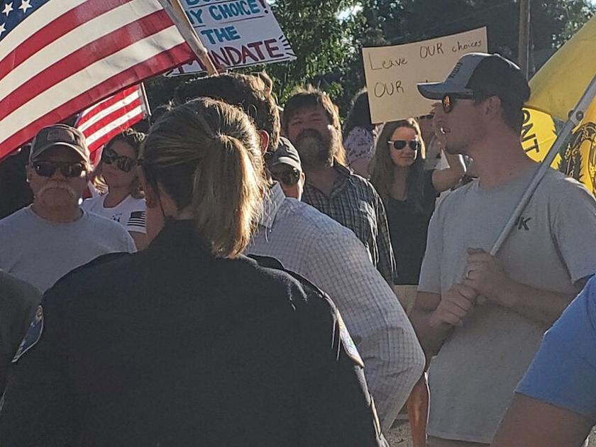 Montrose Memorial Healthcare facility workers oppose vaccine mandate board directors hear concerns as rally fills street | Coronavirus