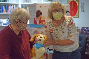 Assisted living residents receive robotic pets, which have been proven to help with memory