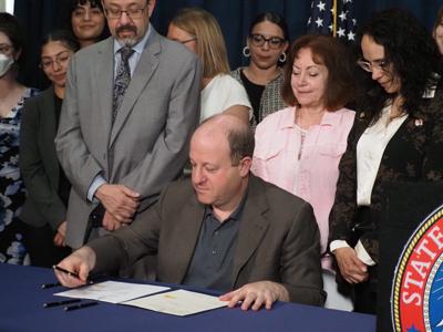 Polis signs duo of Colorado reproductive rights bills into law | State ...