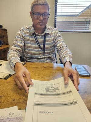 Public health director hopes for 'one-stop shop' services. County's new hire survived bombings, set up care in impoverished nations