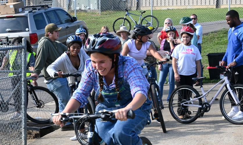 Students riding bicycles in physical education classes at Oakman High