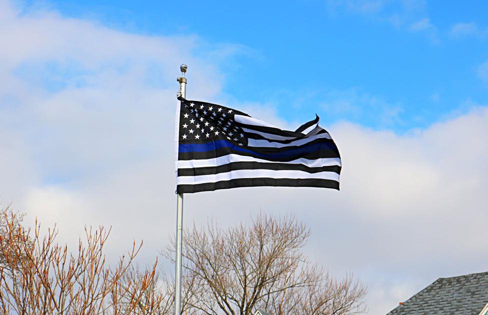Showing solidarity Mount Carmel law enforcement fly a flag of support