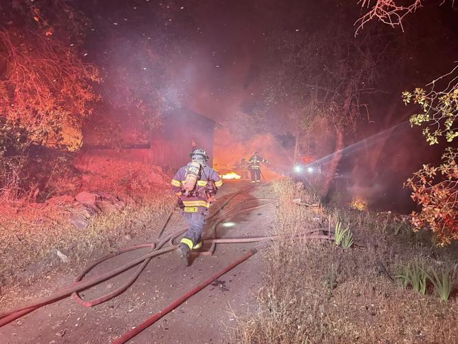 Fire consumes garage on Smith Flat Road News