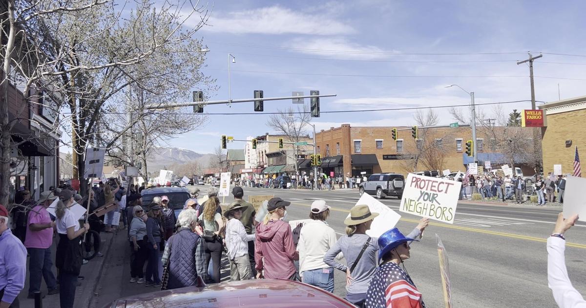 Protesters fill Hailey park, intersection for rally against Trump