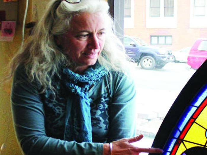 Local artist restores mansion's historic stained-glass window ...
