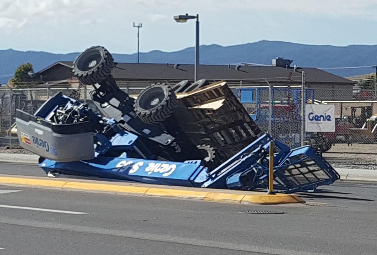 Boom lift tips over on Harrison Avenue
