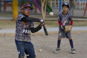 Baseball a shelter for Venezuelan kids in soccer-mad Peru