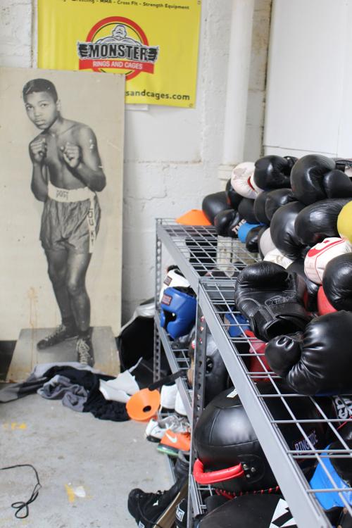 Boxing gloves and other pugilistic gear at Louisville TKO Boxing await young people who, like the pictured 12-year-old Cassius Clay, dream of someday being the greatest -- or at least pretty good.