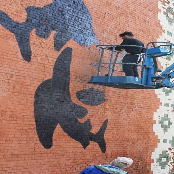 Arctic Grayling Mural Materializes On Uptown Brick Wall Local