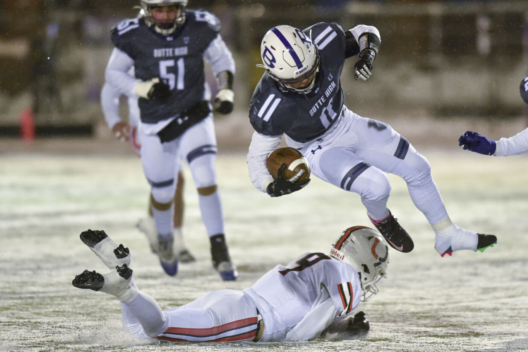 Butte Bulldogs ground-and-pound their way to victory over Billings Senior in snowy playoff conditions