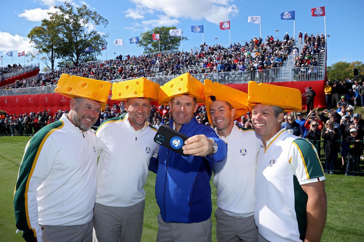 From left, Team Europe's Lee Westwood, Ian Poulter, captain Padraig Harrington, Rory McIlroy and Paul Casey all don cheese head hats during a practice round prior to the 43rd Ryder Cup at Whistling Straits on Wednesday, Sept. 22, 2021, in Kohler, Wis..