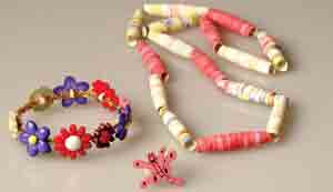 Make jewelry of buttons and rolled paper beads to entertain baby sitter 