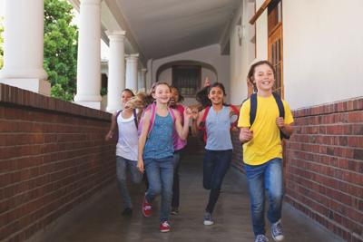 Cute pupils running down the hall
