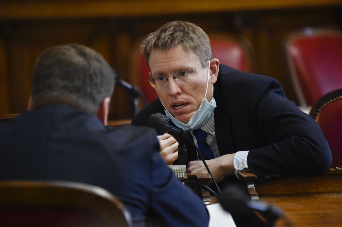 Rep. Steve Fitzpatrick, R-Great Falls, right, speaks with Senate President, Sen. Mark Blasdel, R-Kalispell,