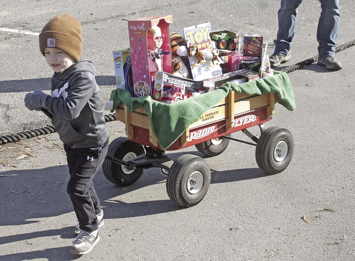 Pulling a truck for community’s kids; Towing for Toys builds head of