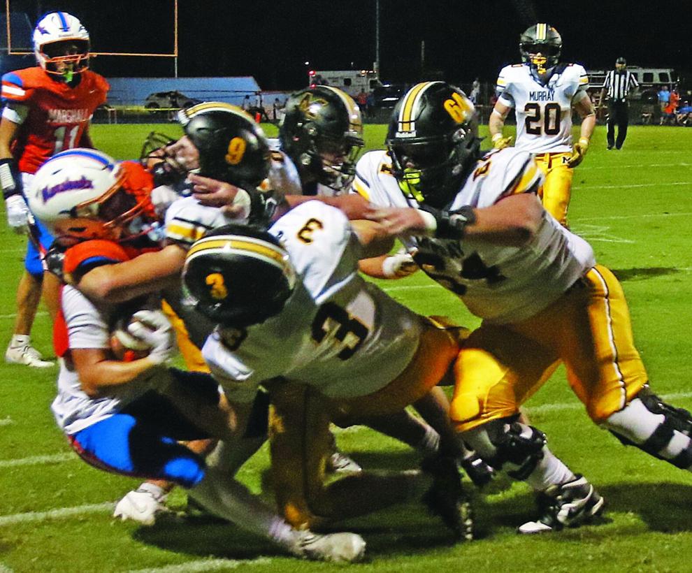 Tigers stay perfect with easy victory over host Marshall