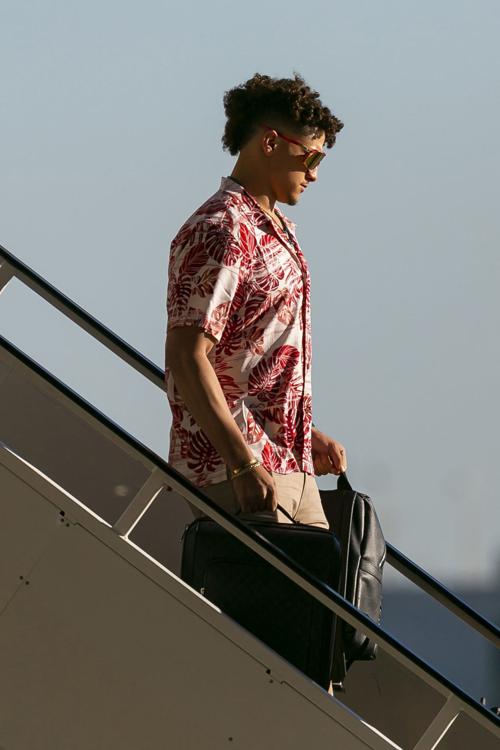 Kansas City Chiefs quarterback Patrick Mahomes (15) arrives alongside teammates and coaches at Miami International Airport in Miami, Fla. on Sunday, Jan. 26, 2020. The Kansas City Chiefs will face off against the San Francisco 49ers at Super Bowl LIV in Hard Rock Stadium next Sunday, Feb. 2, 2020.