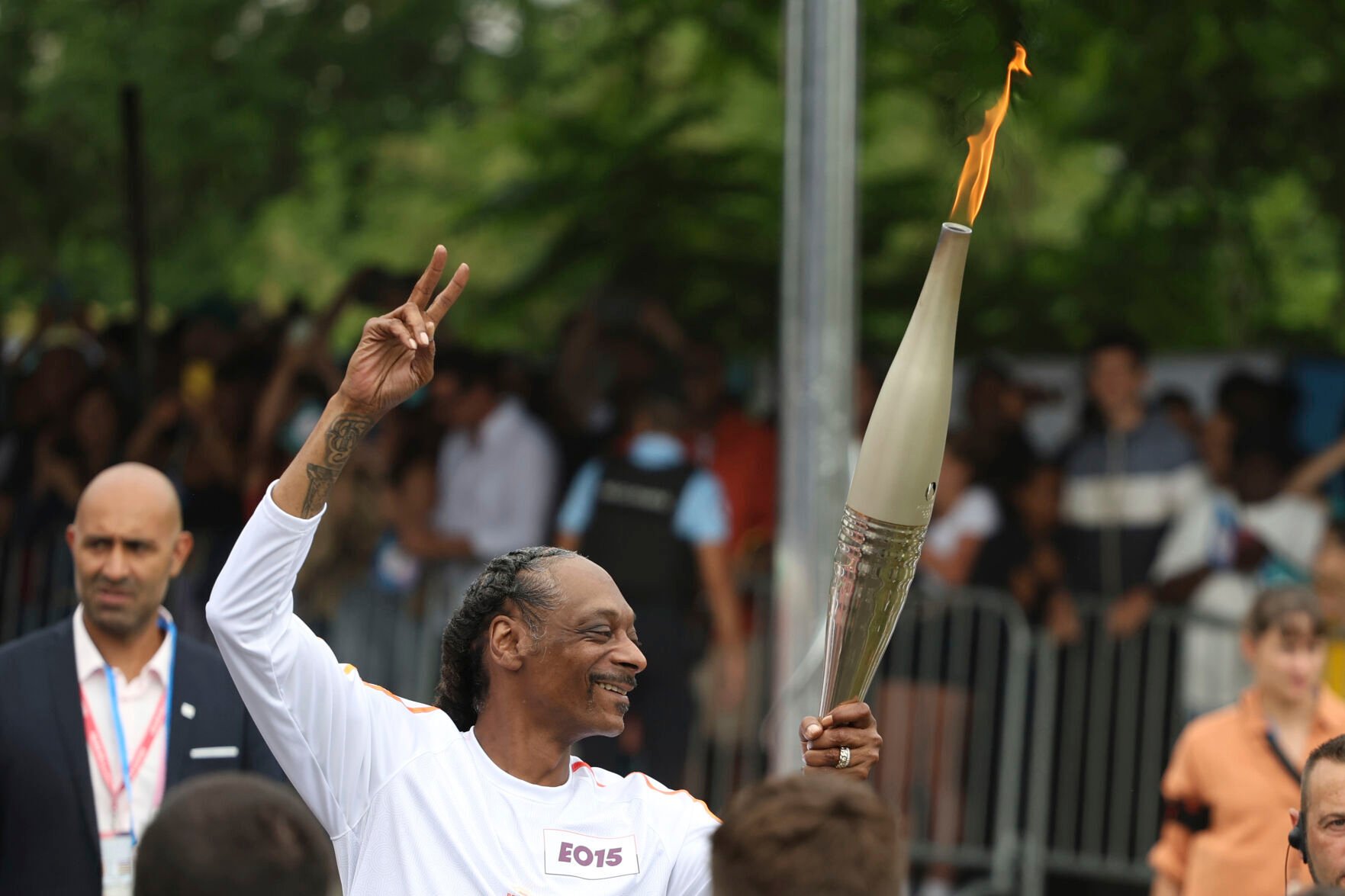 Snoop Dogg Carries Olympic Torch Before Games Open In Paris