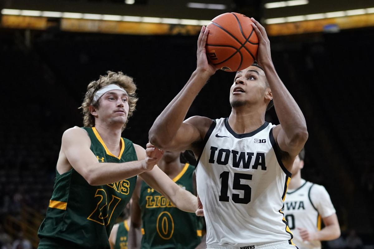 Iowa forward Keegan Murray, right, dunks against Ohio State guard Eugene  Brown during the second half of an NCAA college basketball game in  Columbus, Ohio, Saturday, Feb. 19, 2022. Iowa won 75-62. (