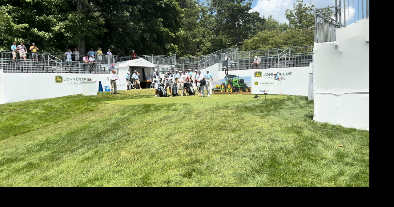 Scenes from the first hole at TPC Deere Run on day one of the John Deere Classic