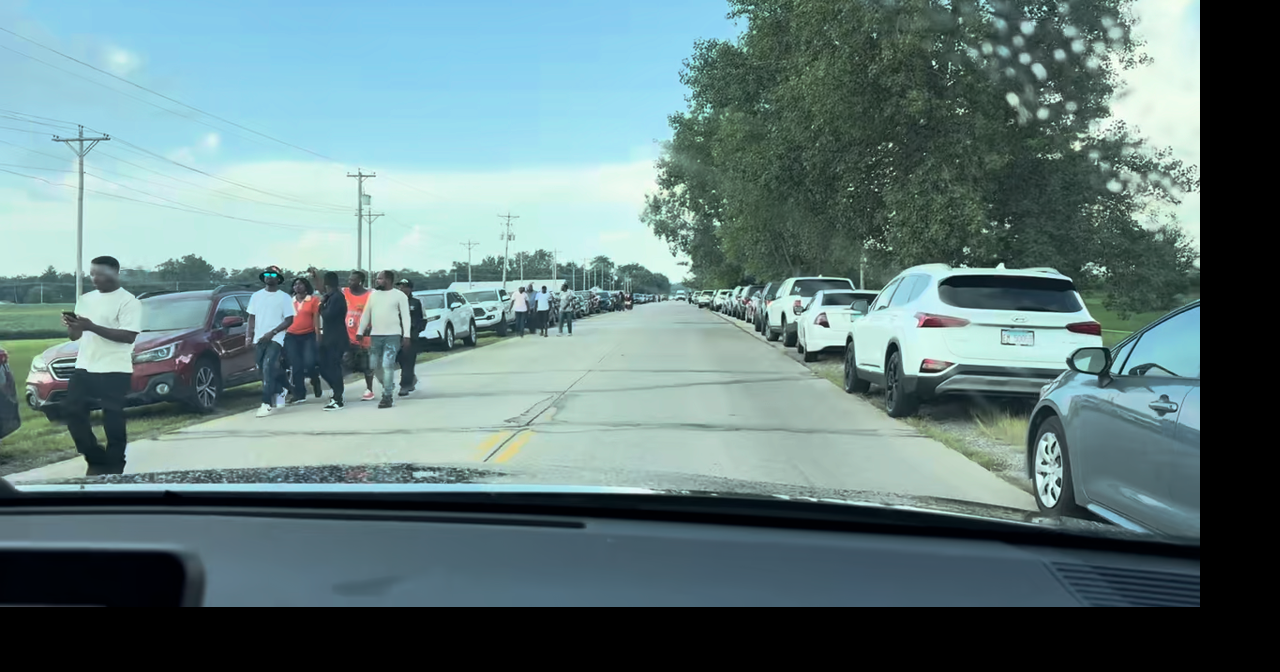 Cars line both sides of the road near the Tyson Plant in Joslin