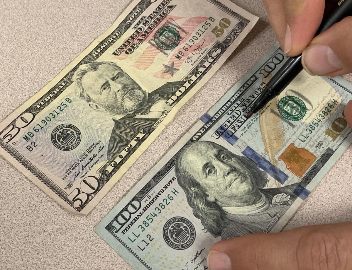Telling a real dollar bill from a fake one