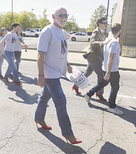 Residents feet support domestic violence awareness News