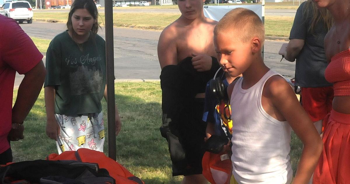 Children get backpacks, custard and reading lists at giveaway