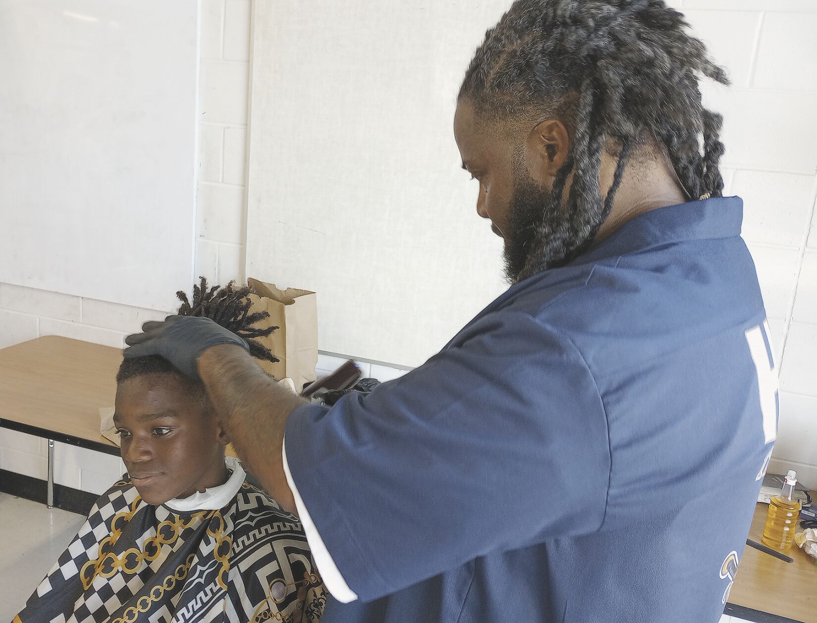 Boys get spruced up for school with free hair cut Community