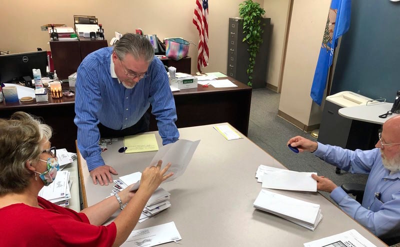 Local election officials verify historic number of absentee ballots