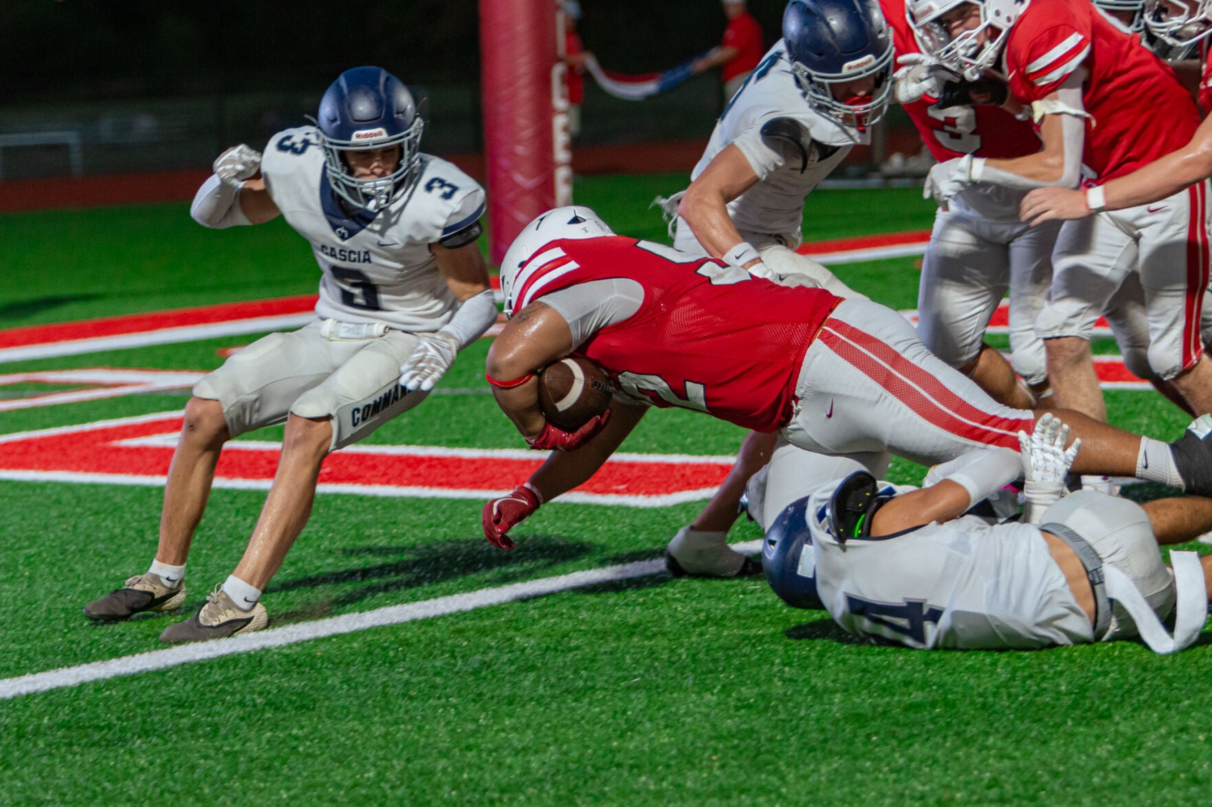 Fort Gibson offensive line blocking during high school football preseason action