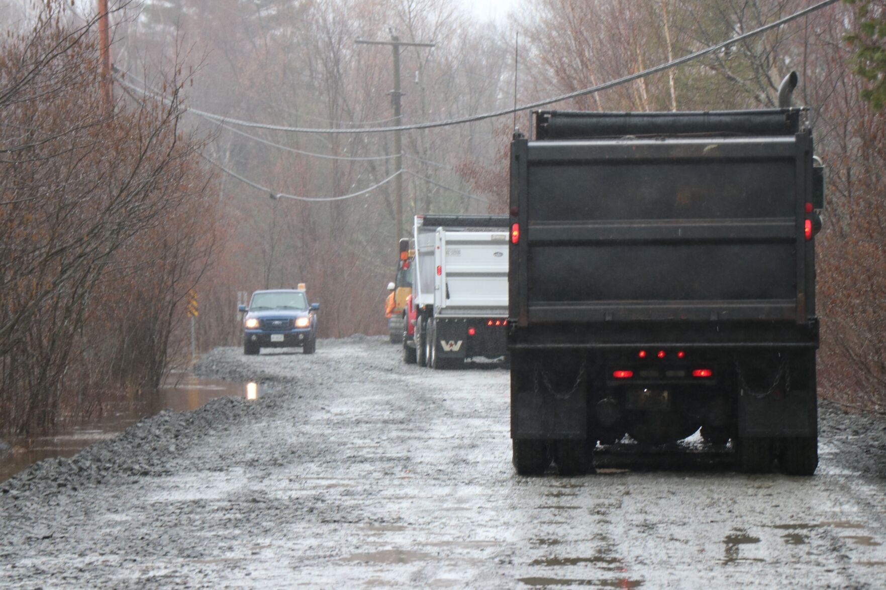 Crews building up flooded Beaumont drive in Bracebridge