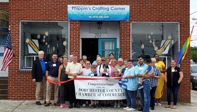 Loved ones and community members celebrate the Chamber ribbon cutting at Phippin's Crafting Corner