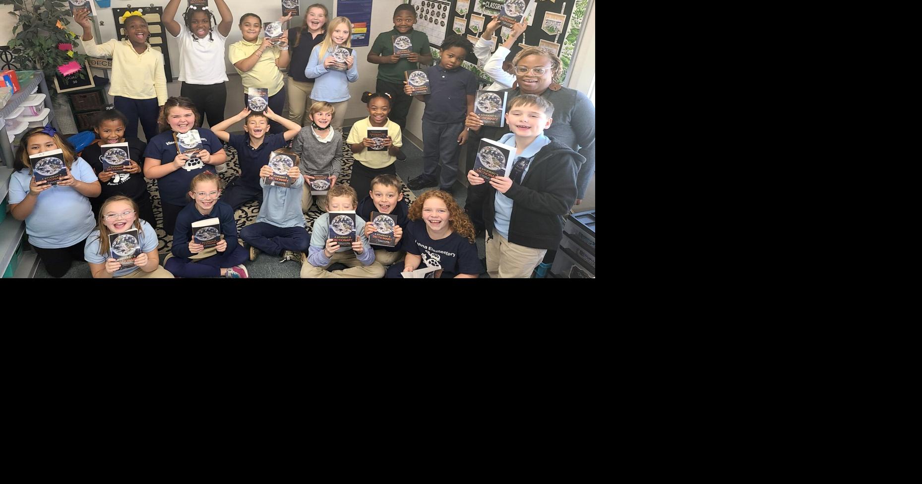 Third graders at Vienna Elementary School receive dictionaries from the