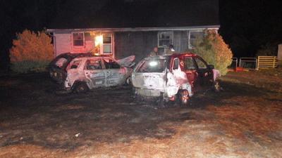 Gutted cars show the damage caused by the fire