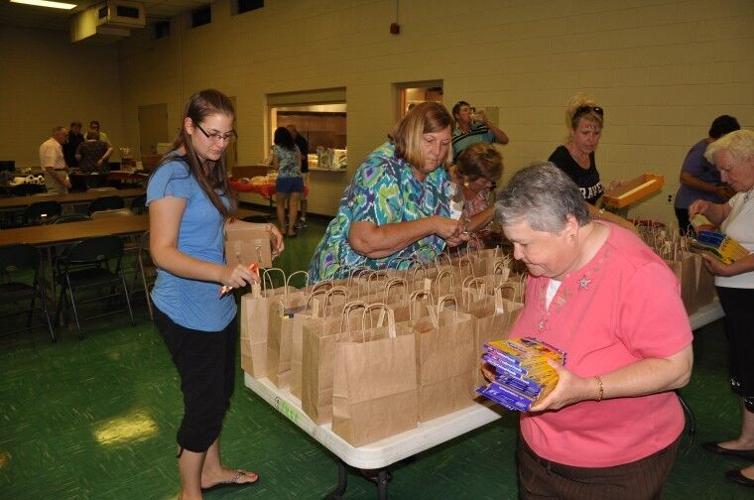 Federalsburg Lions Club pack school supplies at crab feast News