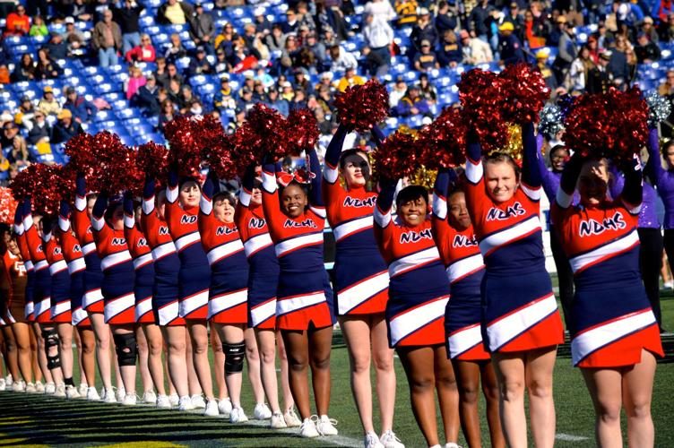 Photo Gallery North Dorchester cheer team performs at Navy football