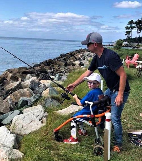 Father and son fish in memorial tournament