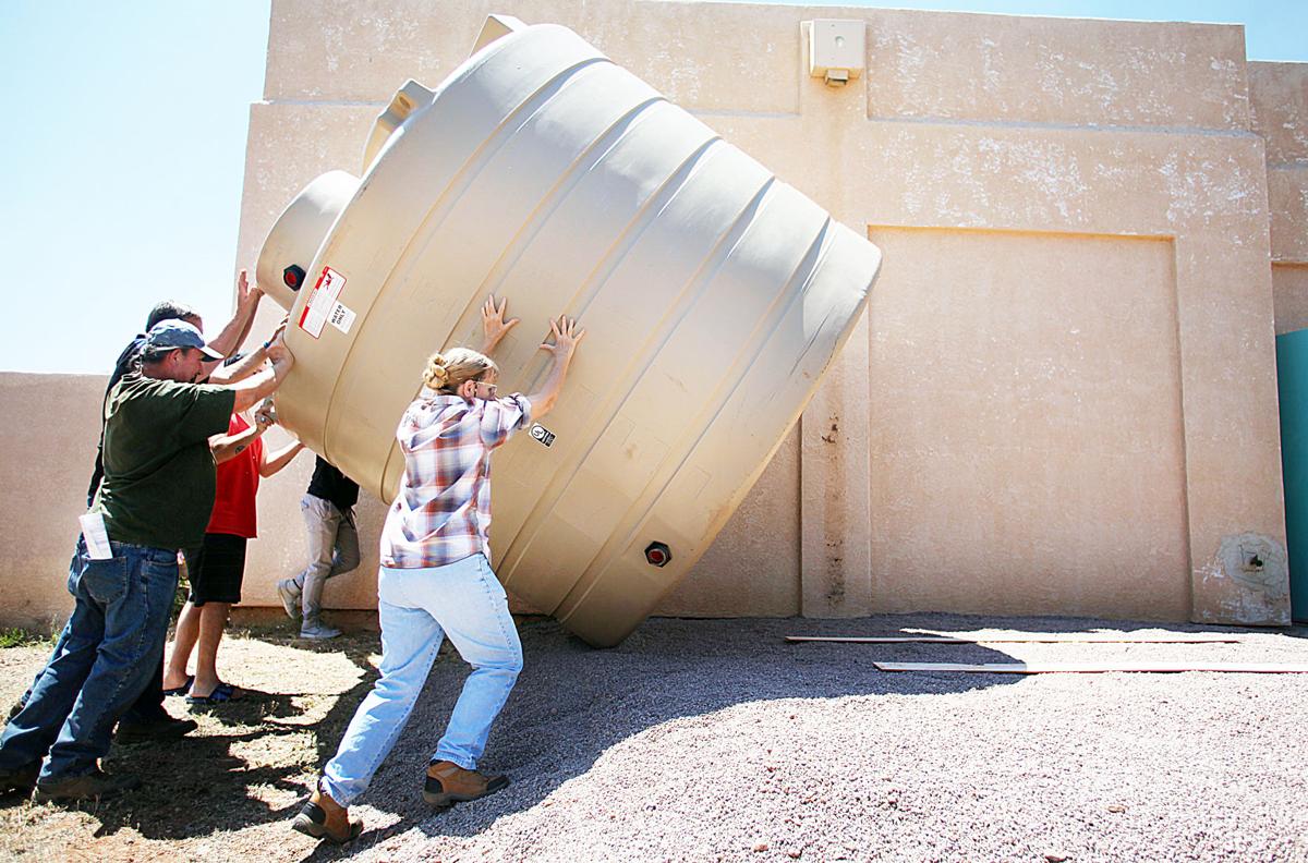 Harvesting rainwater Huachuca City Library receives water storage tank