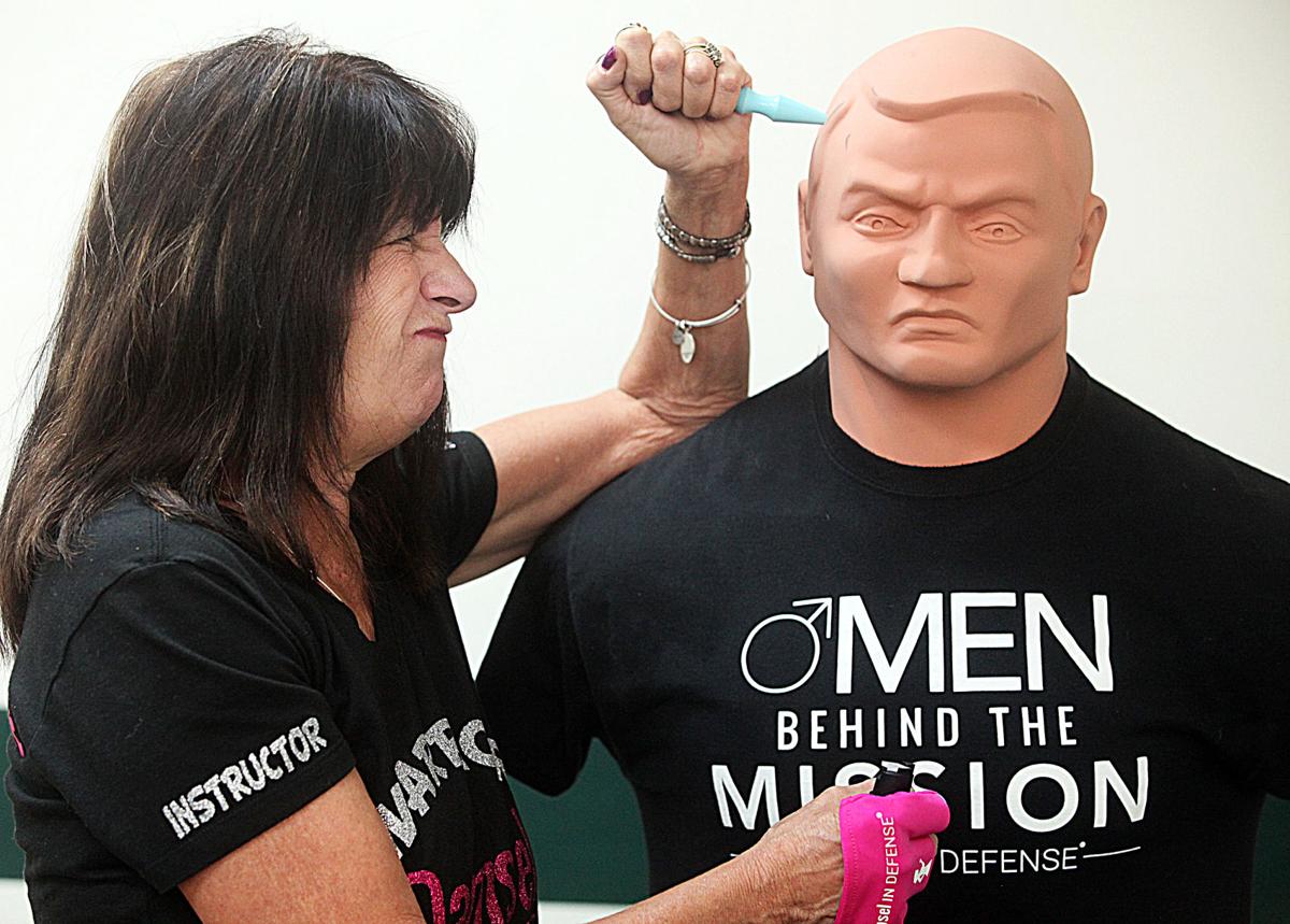 Liz Nelson Damsel In Defense Women S Self Defense Instructor Demonstrates How To Fend Off An Attacker Using A Pepper Spray Glove And A Striking Device Socovitality Myheraldreview Com