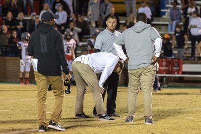 An exasperated MP coach Brian Nelson meets with the Pike coach after 5 Pike players were ejected.