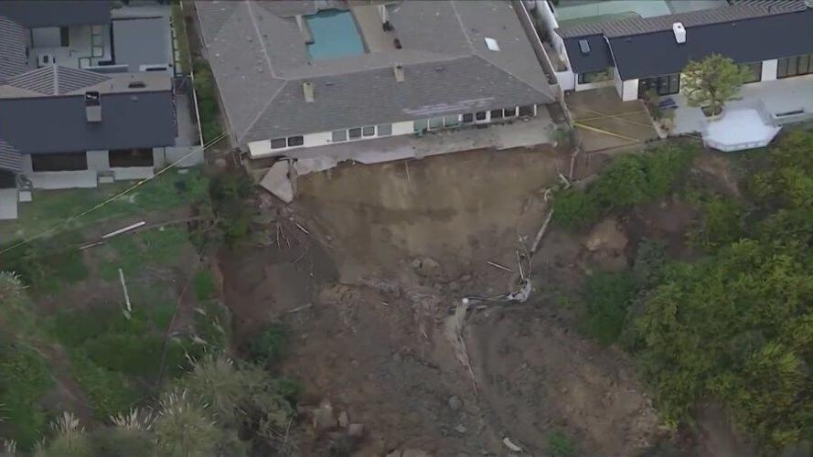 Portions of California home seen hanging over cliff after landslide in ...