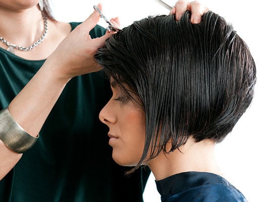woman getting a haircut