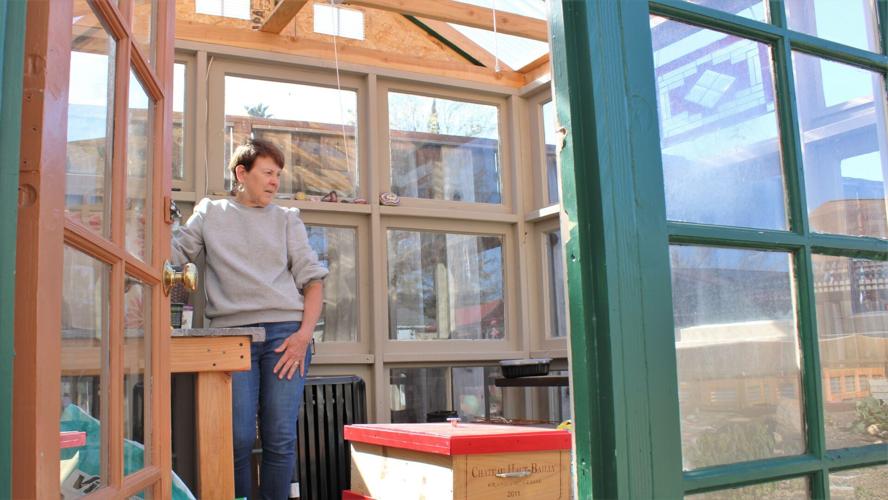 Debbie Stevens inside greenhouse